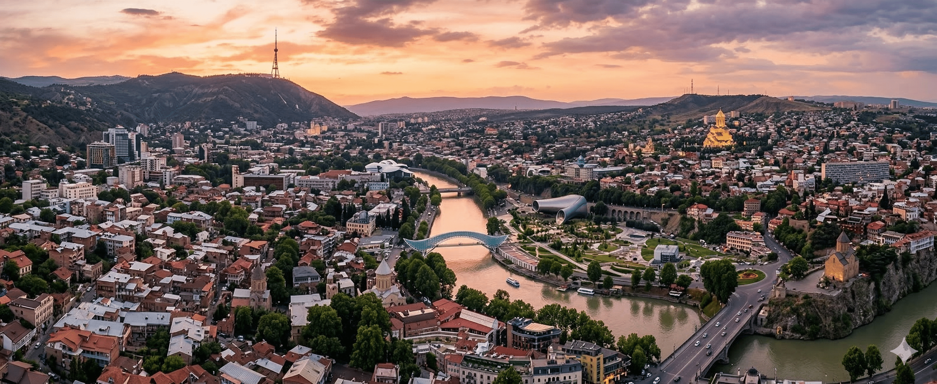 Aerial panoramic view of Tbilisi city center and the Kura River.
