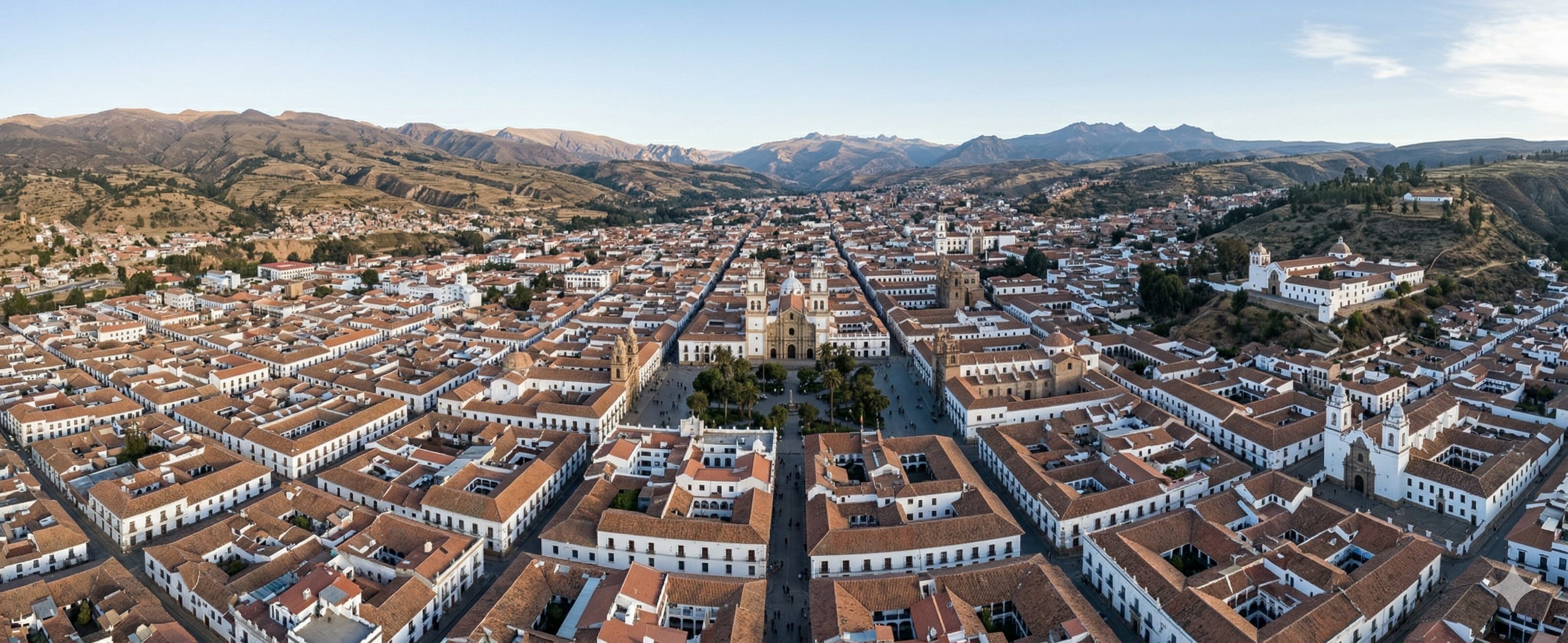 White buildings and terracotta roofs of Sucre from an aerial perspective, podology classes landing page.