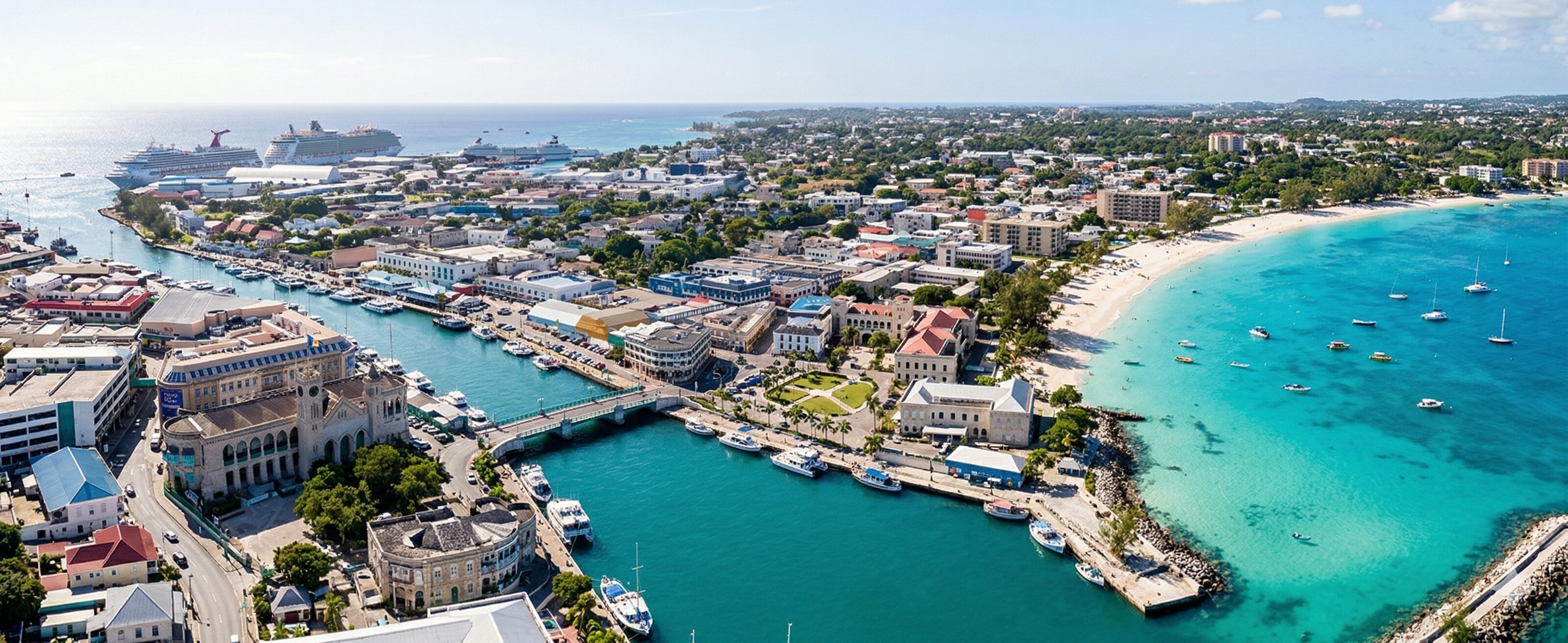 Aerial photograph of Bridgetown, Barbados, showing the Careenage and Carlisle Bay at golden hour.